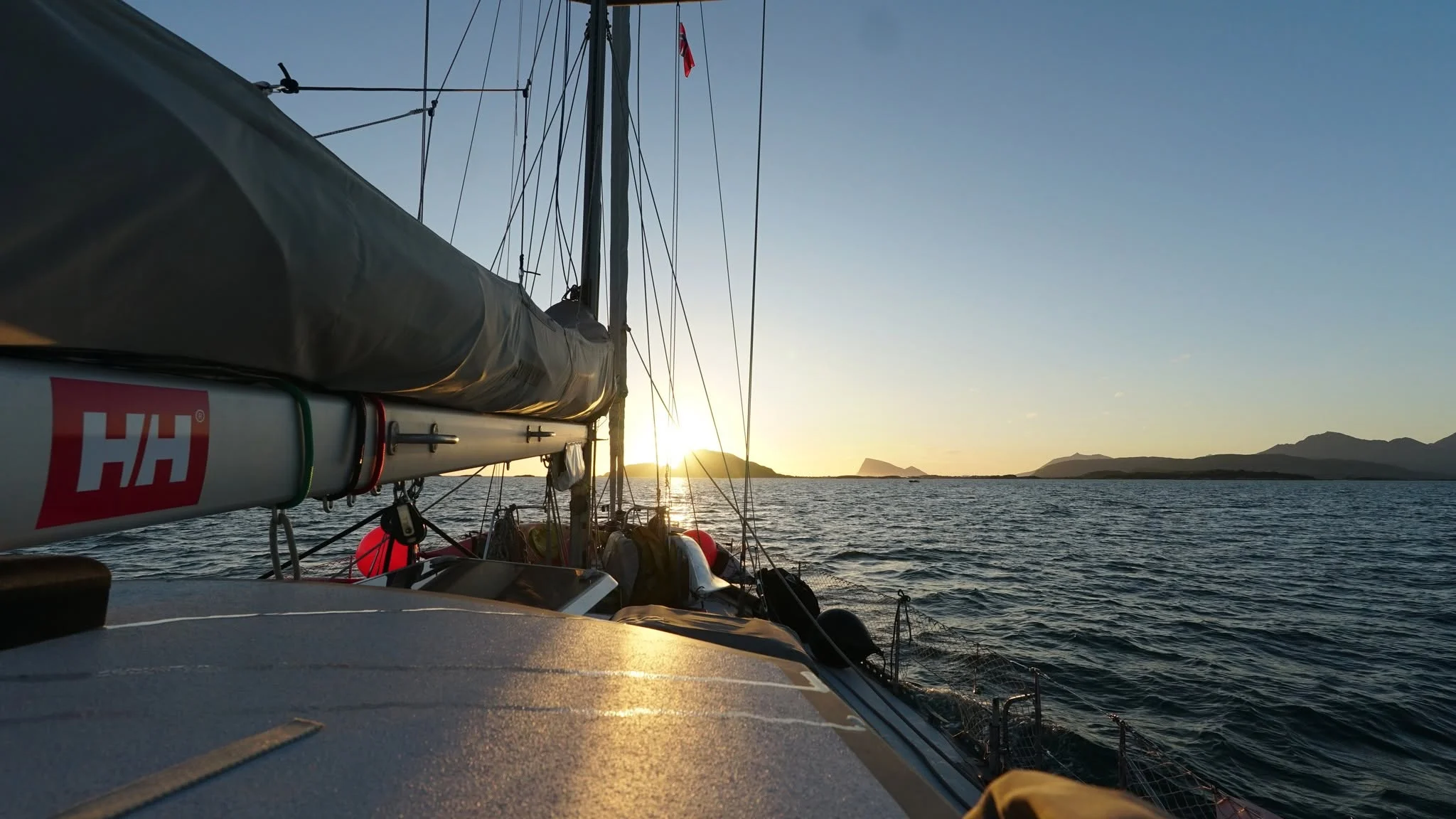Arctos sailing at sunset during an offshore voyage